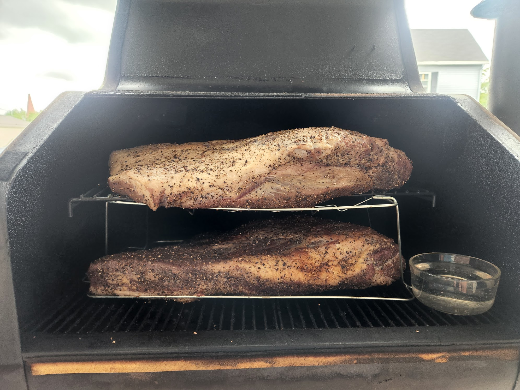 An older two-brisket setup before I added the baking-sheet heat barrier